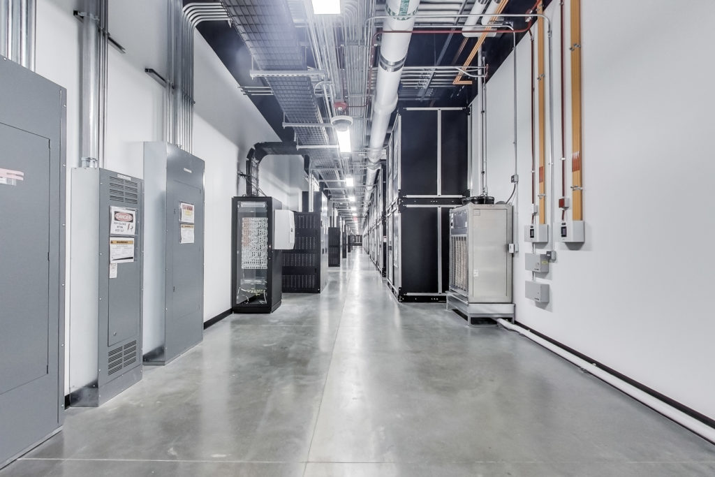 Mechanical hallway in a STACK Infrastructure data center.